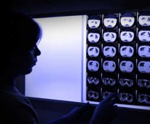 Radiology reviews backlit x-ray scans