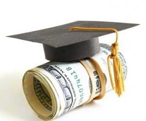scholarship concept - mortarboard atop a money roll