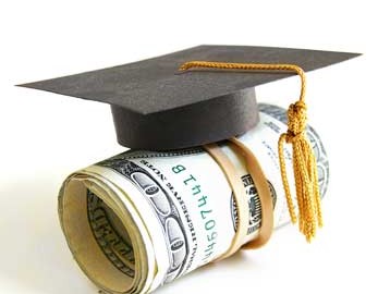 scholarship concept - mortarboard atop a money roll