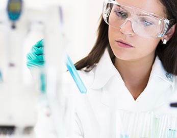 medical lab scientist holding test tube