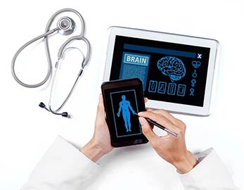 detail of physician's hands holding tablet and stylus with medical information on screen