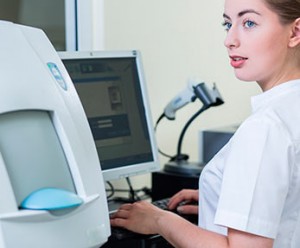 medical assistant at keyboard