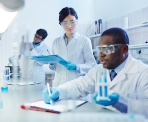 Young scientists analyzing substances in laboratory