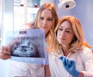 radiologic technologist and physician review scan together